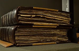 A women takes photo of open manuscript
